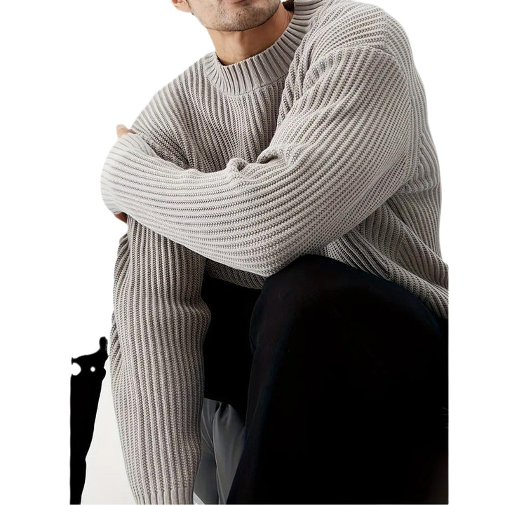 Versatile men's grey crewneck sweater. Relaxed fit, long-sleeve, and ribbed knit for casual comfort.
