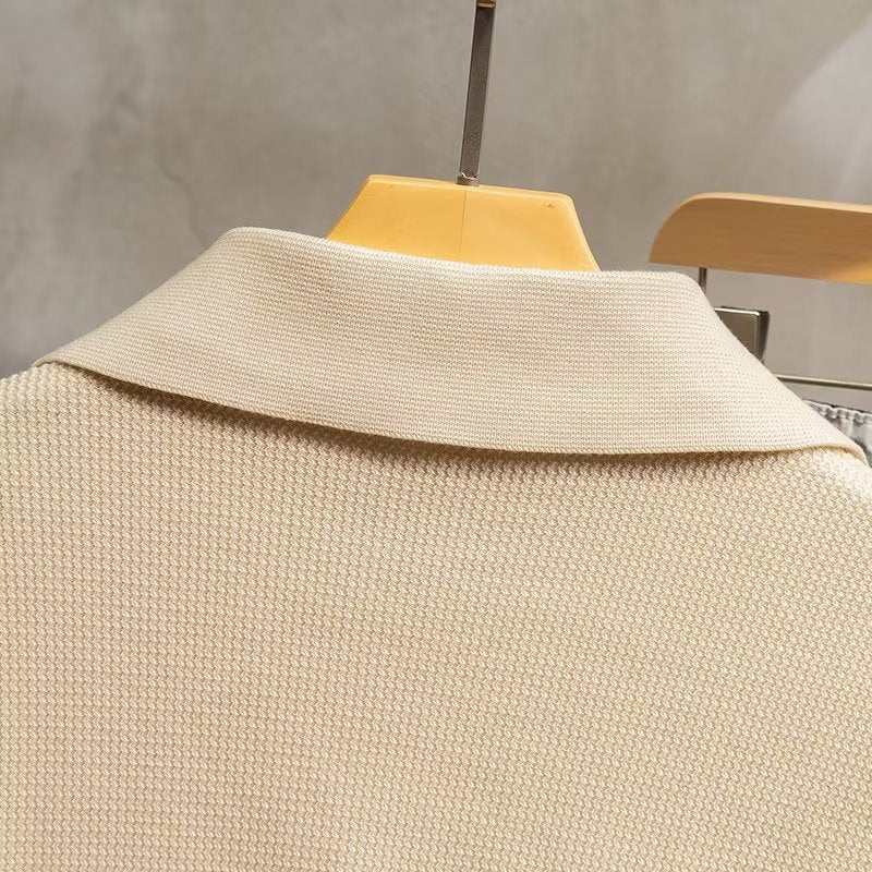 Man wearing a stylish ribbed knit polo sweater, perfect for casual outings or smart casual winter events.