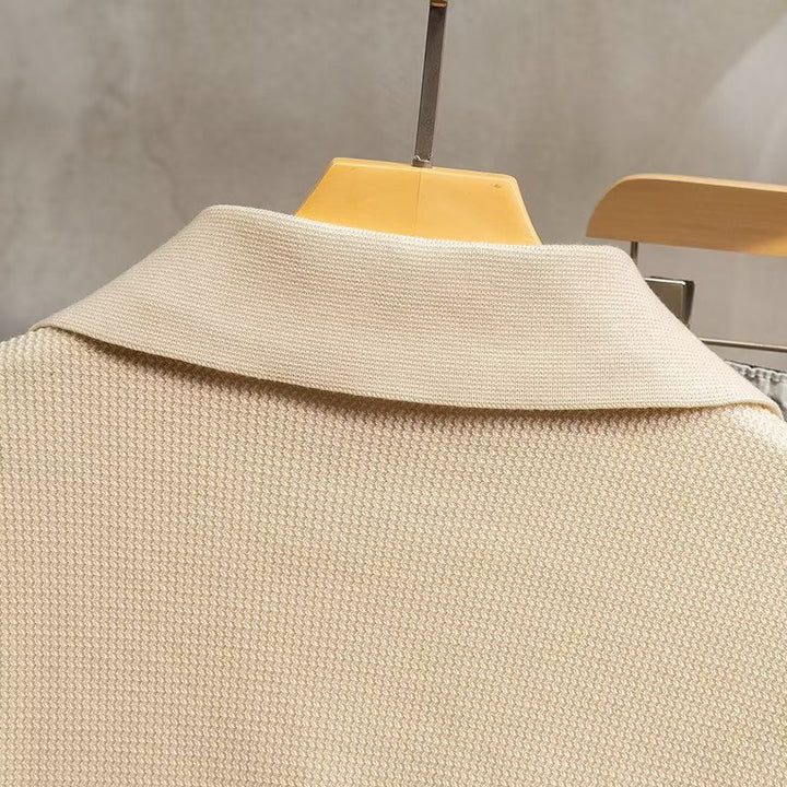 Man wearing a stylish ribbed knit polo sweater, perfect for casual outings or smart casual winter events.