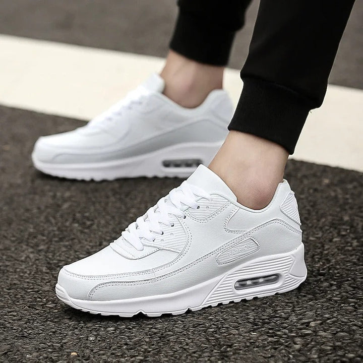 Men's white cushioned street trainers, perfect for everyday wear. Lightweight & comfortable casual sneakers.