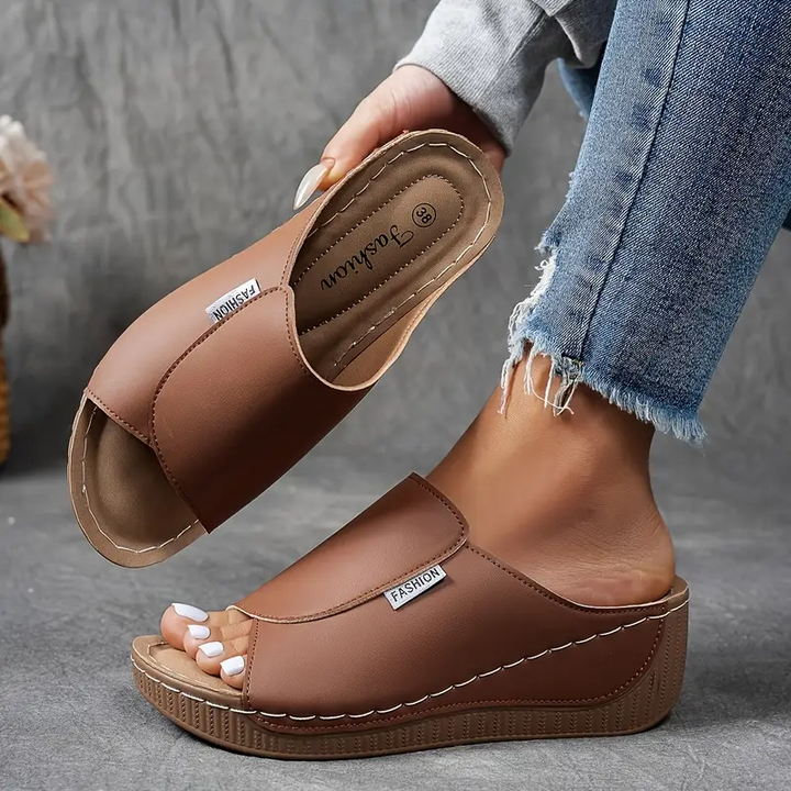 Comfortable women's sage slip-on sandals featuring arch support, ideal for lightweight casual summer footwear.