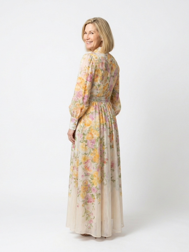 Flowy women's maxi dress featuring a vibrant botanical print and modest long sleeves for women's fashion.
