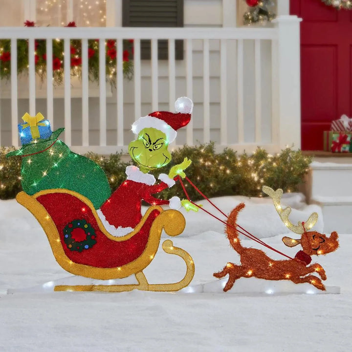 Garden Grinch Christmas decor, illuminated with LED lights, for a festive holiday season.