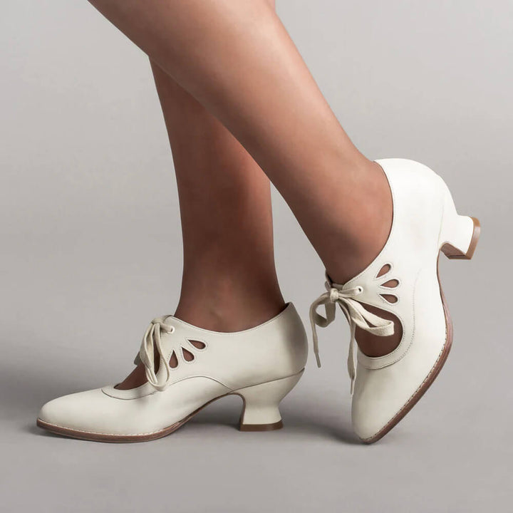 Elegant women's Mary Jane heels with sturdy block heel, ideal for formal vintage style & pin-up fashion.