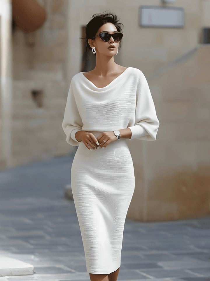 Fashionable ladies' midi dress, elegant round neck, batwing sleeves, perfect for summer chic looks.