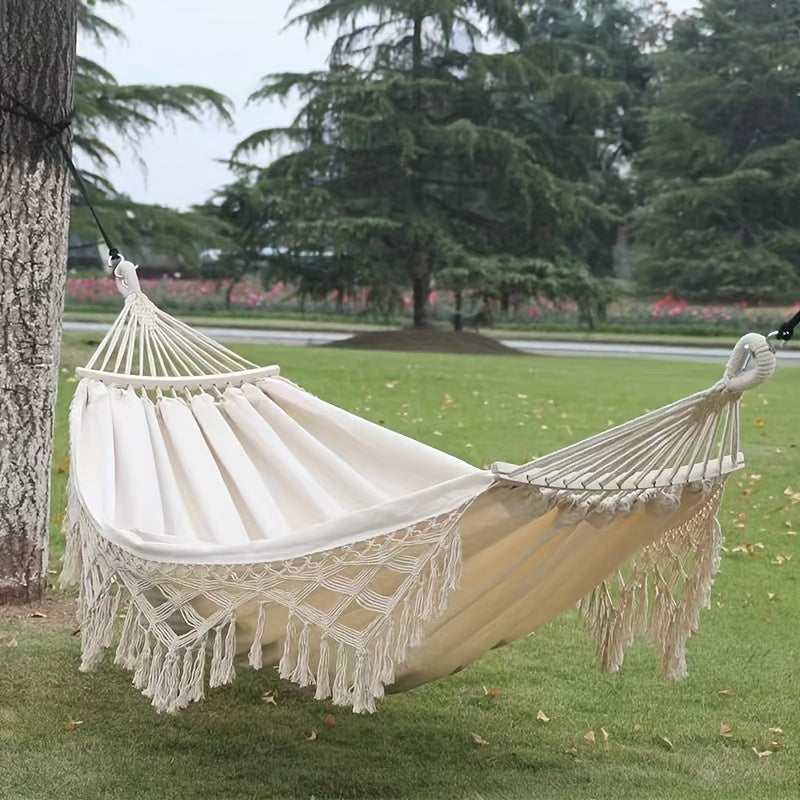 Vibrant striped Tusheng hammock, perfect for bohemian outdoor garden comfort.