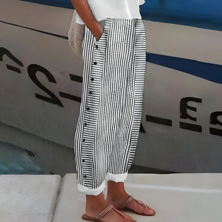 Comfortable women's striped buttoned pants with elastic waist. Ideal for casual summer fashion & travel.