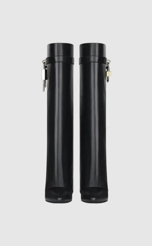 Statement women's tall boots: sculptural wedge, glossy finish, perfect for avant-garde style.