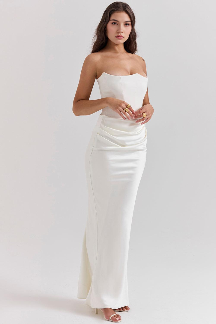 Elegant strapless wedding guest dress, a formal maxi gown for women.