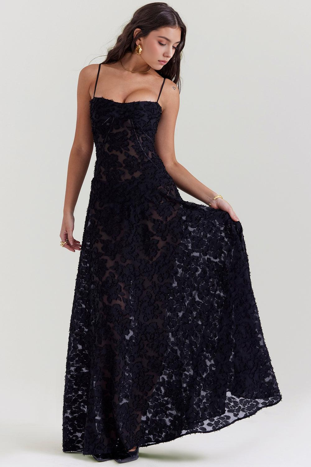 Women's formal maxi dress with beautiful floral print, corset detail, & sheer fabric.