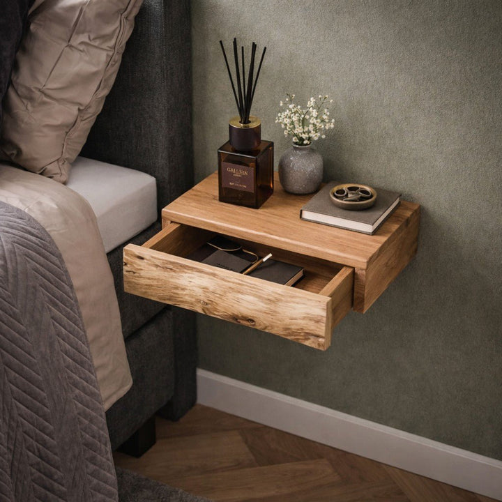 Close-up of a stylish floating nightstand. A single wall-mounted bedside table, part of a versatile set of two.