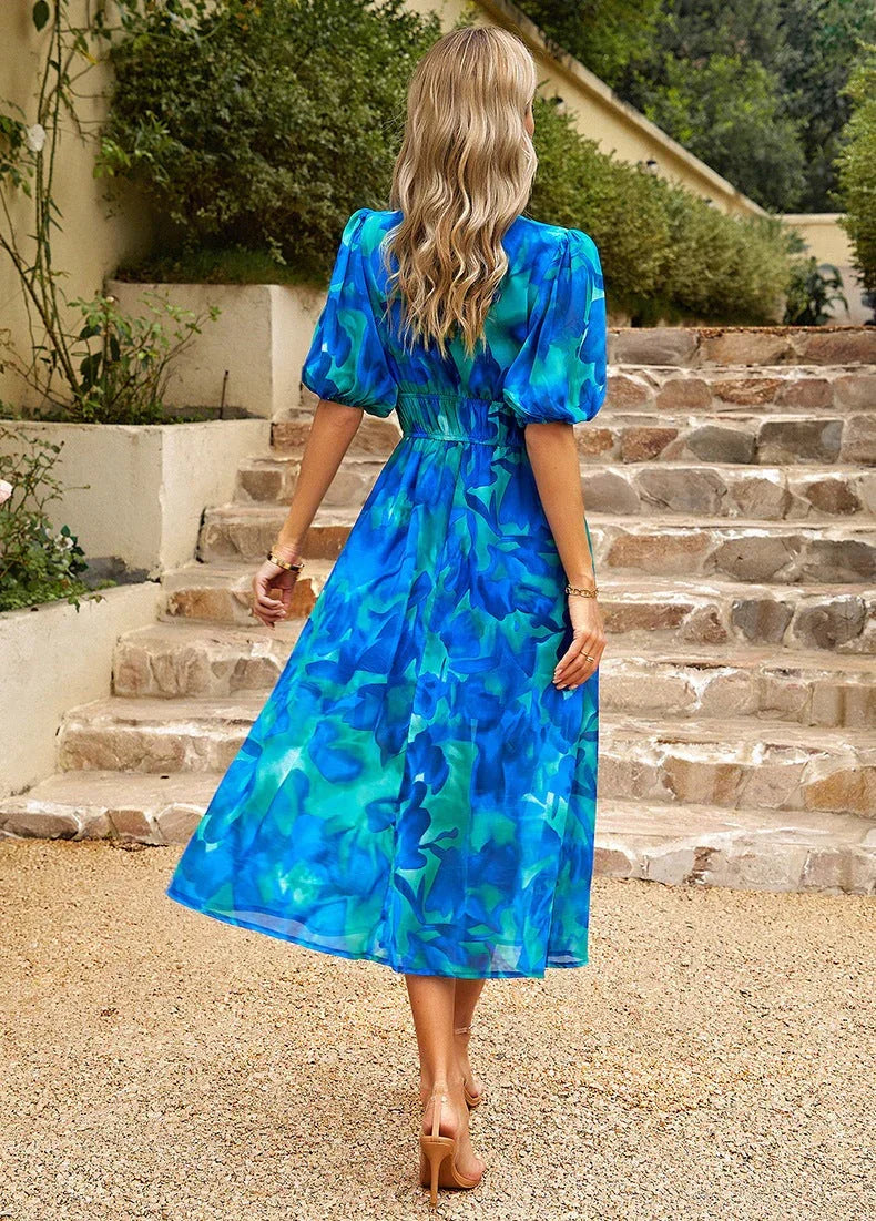 Stylish women's V-neck midi dress, perfect for summer holidays. Comfortable fabric with an elegant drape.