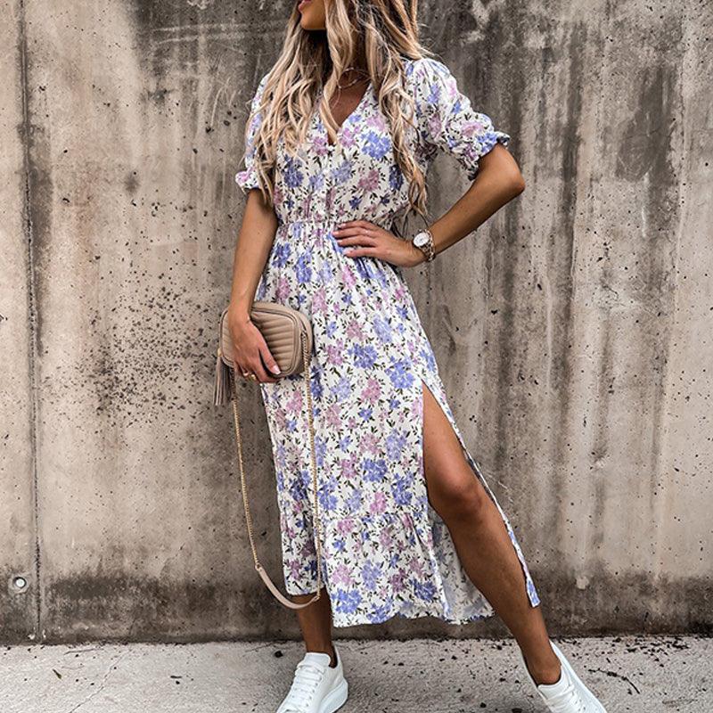 Floral button-front maxi dress with side slit, vibrant floral print, perfect for casual or formal occasions.