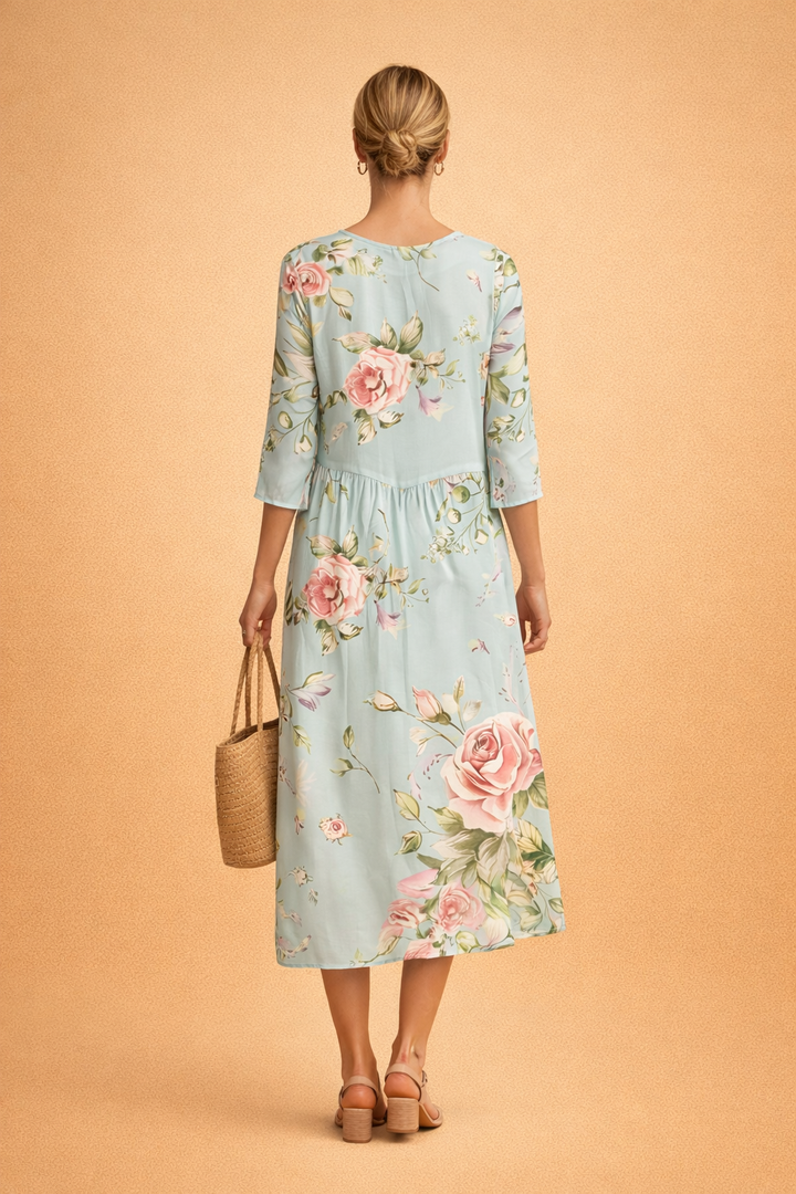Relaxed fit women's midi dress, elegant floral pattern, great for casual wear.