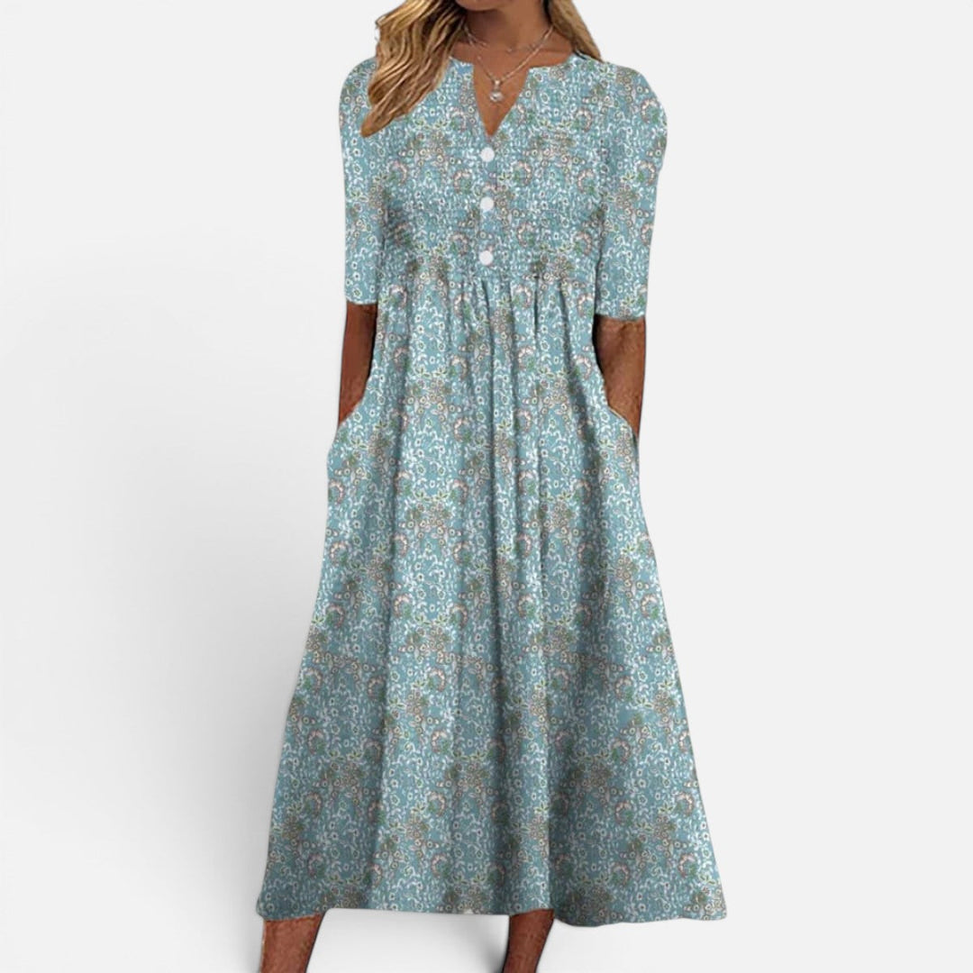 Versatile women's floral midi dress with buttoned front & pockets; ideal for everyday elegant spring & summer style.