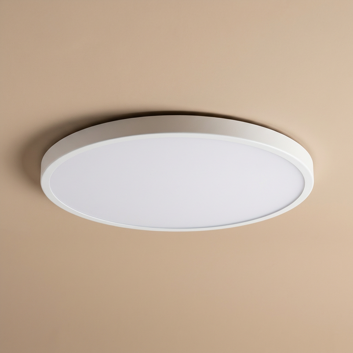 Slim round LED ceiling light, elegant gold trim, modern ambient lighting, energy efficient.