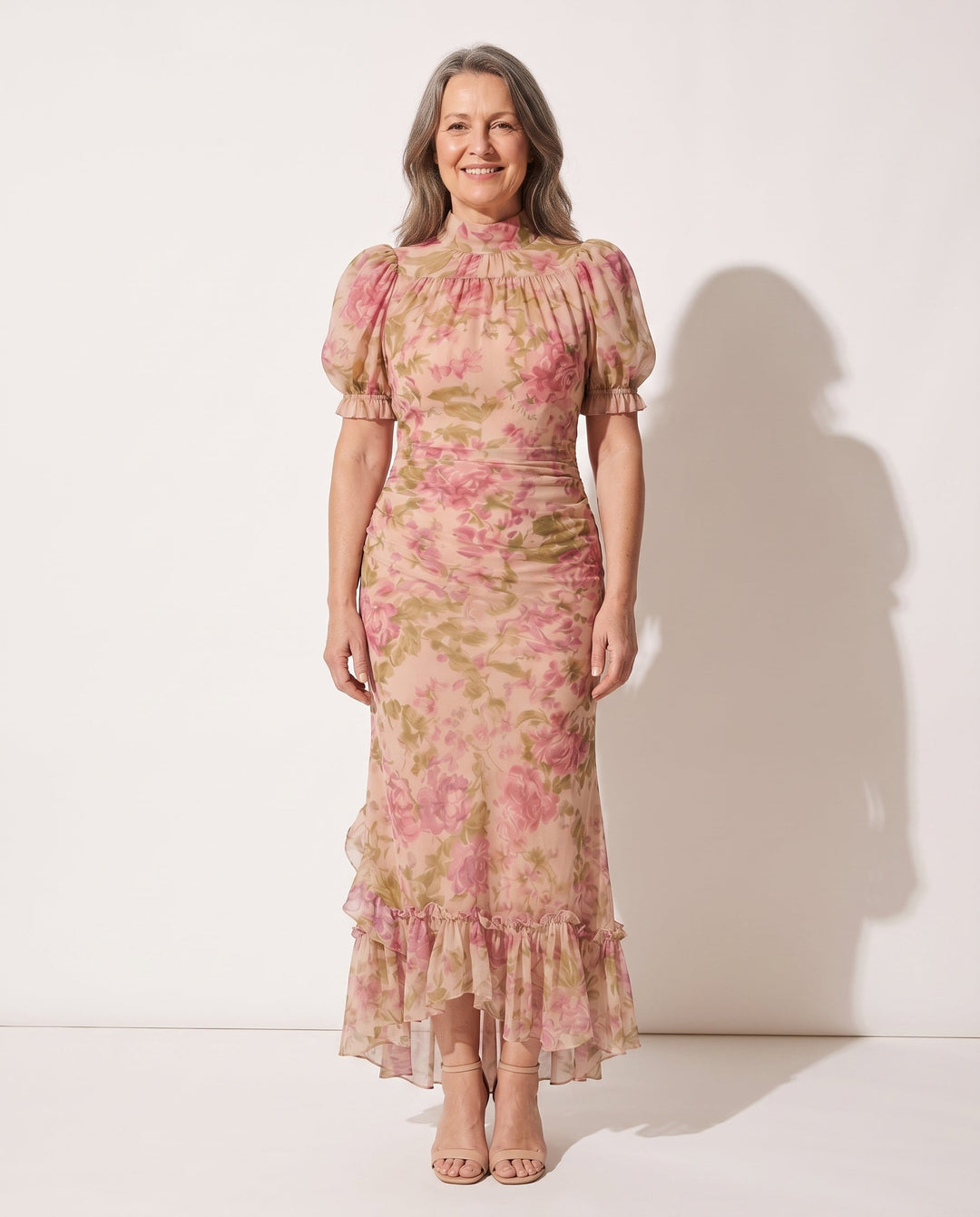 Elegant pink/lilac floral print maxi dress for women, with puff sleeves, ruffles, high neck. Ideal for garden party.