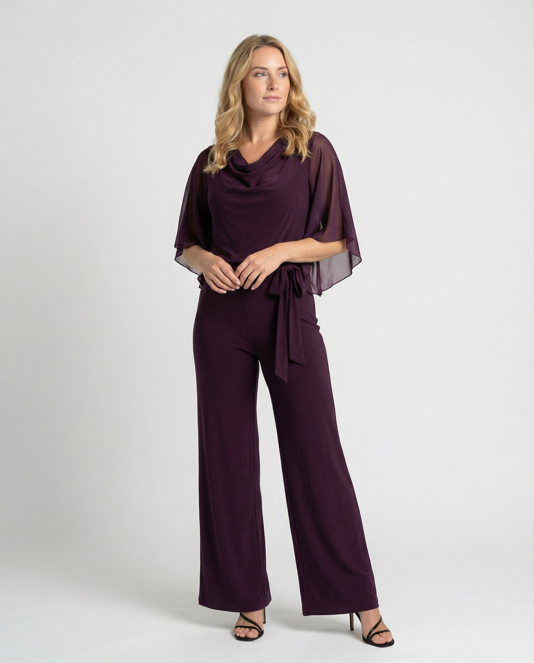 Elegant women's wide-leg jumpsuit with chic cascading neckline & flattering lace-up waist detail.