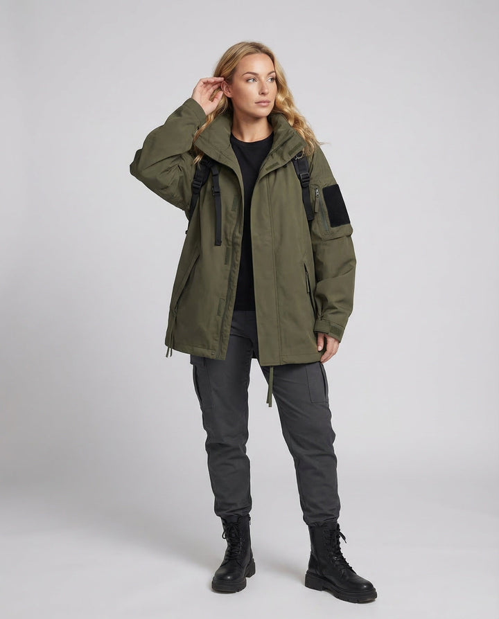Women's oversized waterproof zipped jacket for outdoor comfort & all-weather protection. Ideal travel-ready outerwear.