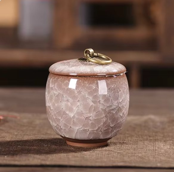 Detailed view of the craquelé glaze on a ceramic pet urn, a tender pet loss memorial.