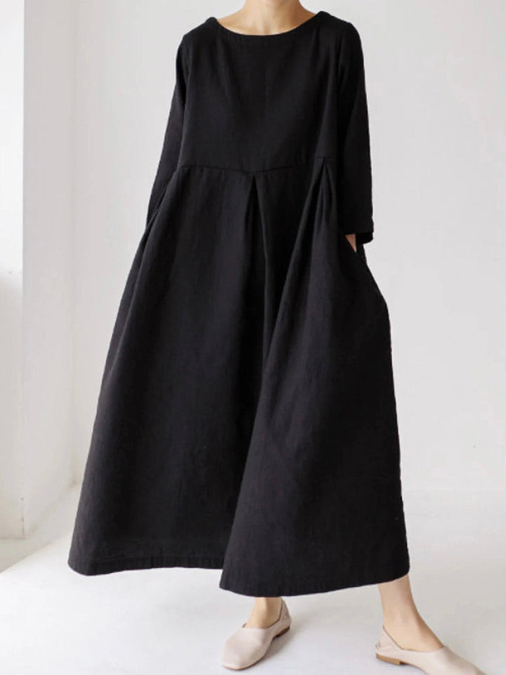 Comfortable women's long sleeve tiered maxi dress, relaxed silhouette with a round neck and practical side pockets.