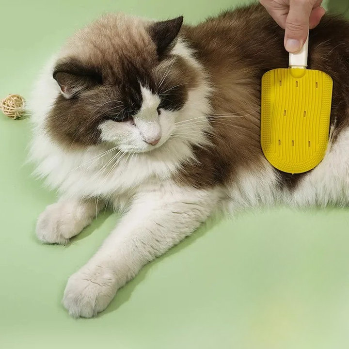 Gentle pet deshedding brush for dogs & cats, effective fur removal grooming tool.