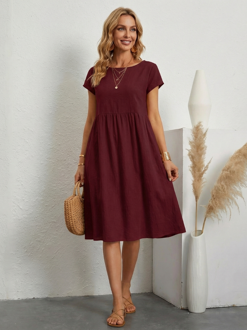 Everyday women's short sleeve knee length pocket dress. Practical design, comfortable for daily wear.