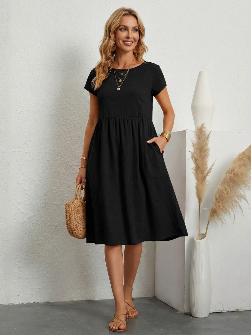 Relaxed fit women's short sleeve knee length pocket dress. Perfect summer style for casual everyday wear.