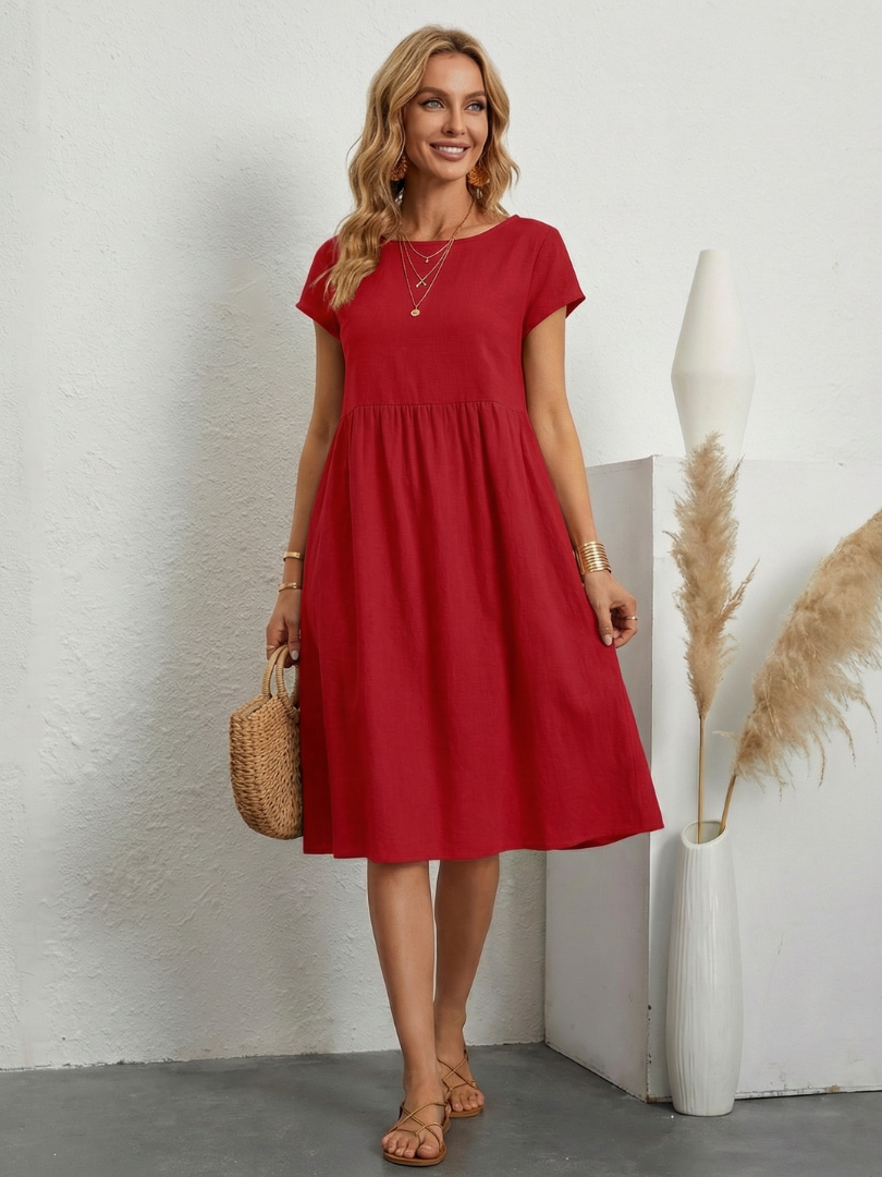 Women's short sleeve knee length pocket dress. Practical & comfortable for versatile casual everyday style.