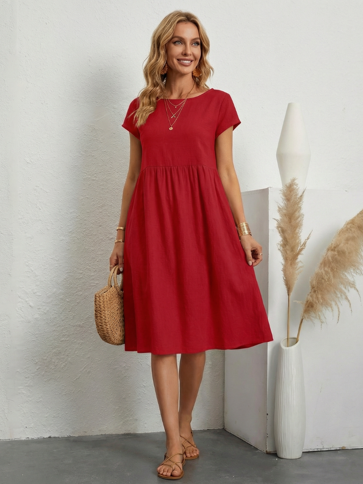 Women's short sleeve knee length pocket dress. Practical & comfortable for versatile casual everyday style.