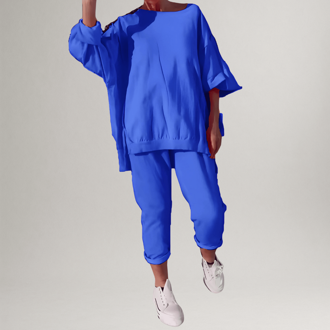 Model walking in a women's casual matching set: an oversized blouse & wide-leg trouser outfit for daily wear.