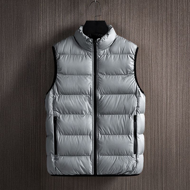 Men's lightweight quilted puffer vest in black, offering warmth & style for layering during winter.