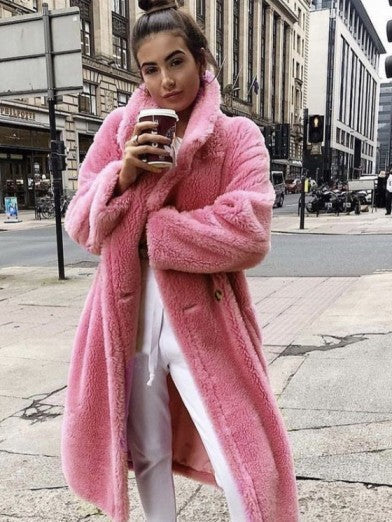 Chic women's long winter jacket. Elegant outerwear for a glamorous winter fashion statement and warmth.