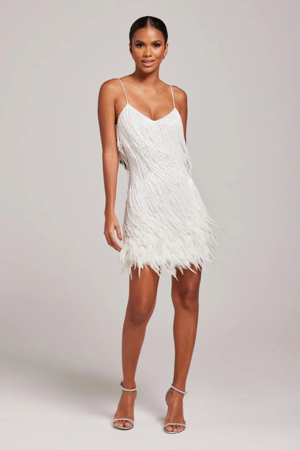 Elegant cocktail party dress for women, adorned with stylish fringe and luxurious feather details.