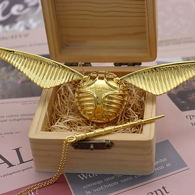 Ornate Golden Winged Orb ring holder, gold-plated, luxury collectible & fantasy home decor.