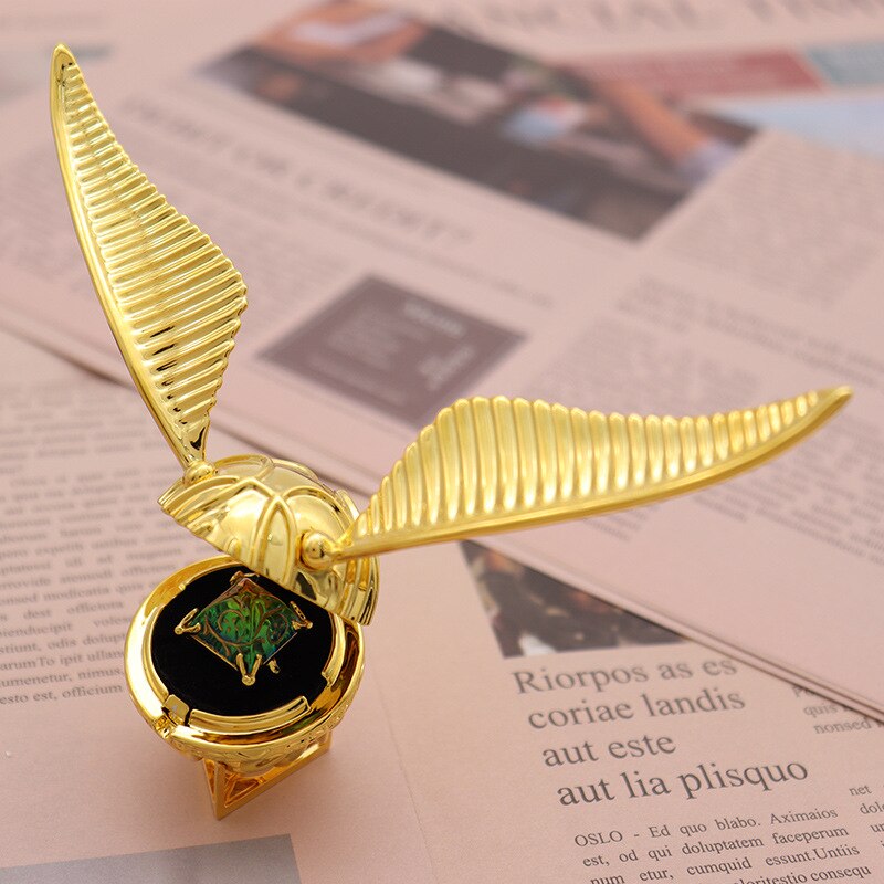 Luxury movable Golden Winged Orb Ring Box, gold-plated for unique jewelry storage.