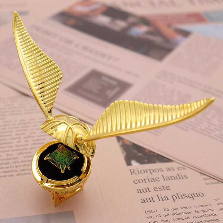 Luxury movable Golden Winged Orb Ring Box, gold-plated for unique jewelry storage.