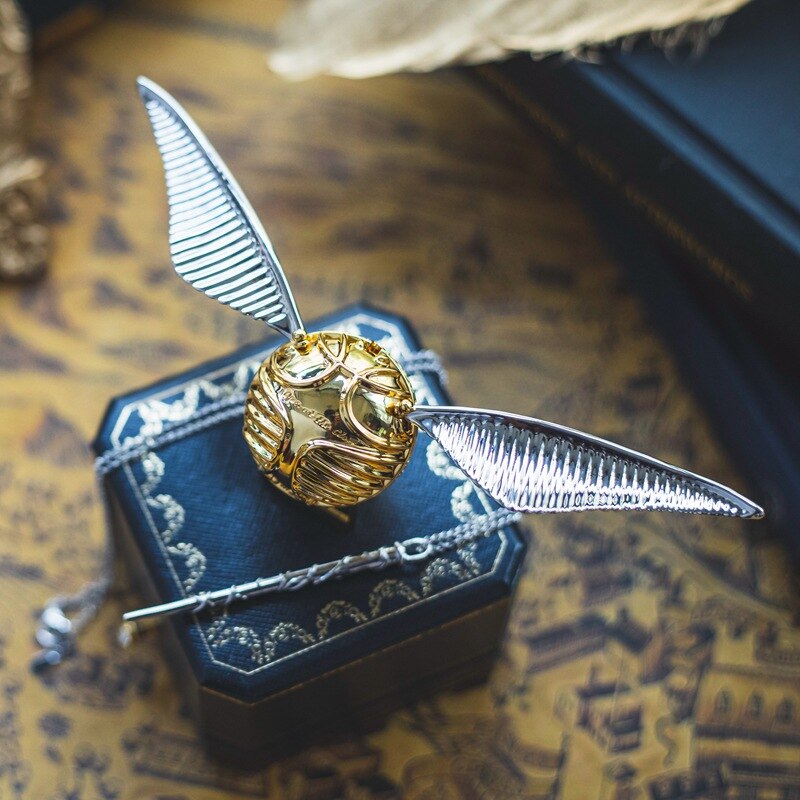 Silver-plated Golden Winged Orb jewelry box, luxury display for rings, unique fantasy decor.