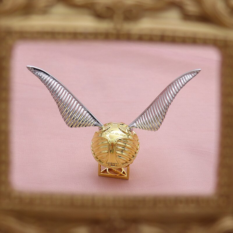 Luxurious gold-plated Golden Winged Orb ring display case, perfect for fantasy enthusiasts.