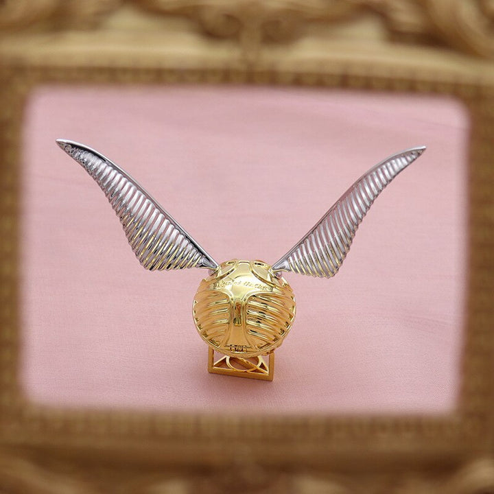 Luxurious gold-plated Golden Winged Orb ring display case, perfect for fantasy enthusiasts.