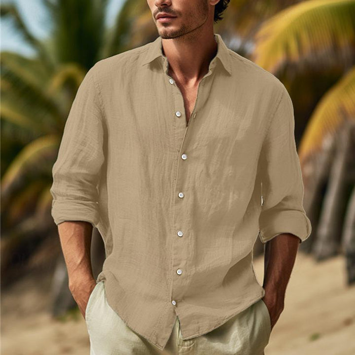 Comfortable men's white long sleeve casual button-down shirt. Versatile and stylish everyday fashion.
