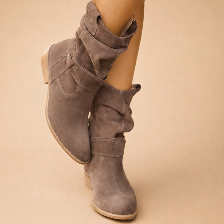 Elegant women's ankle boots featuring a slouch design and buckle accents. Versatile for winter & fall fashion.
