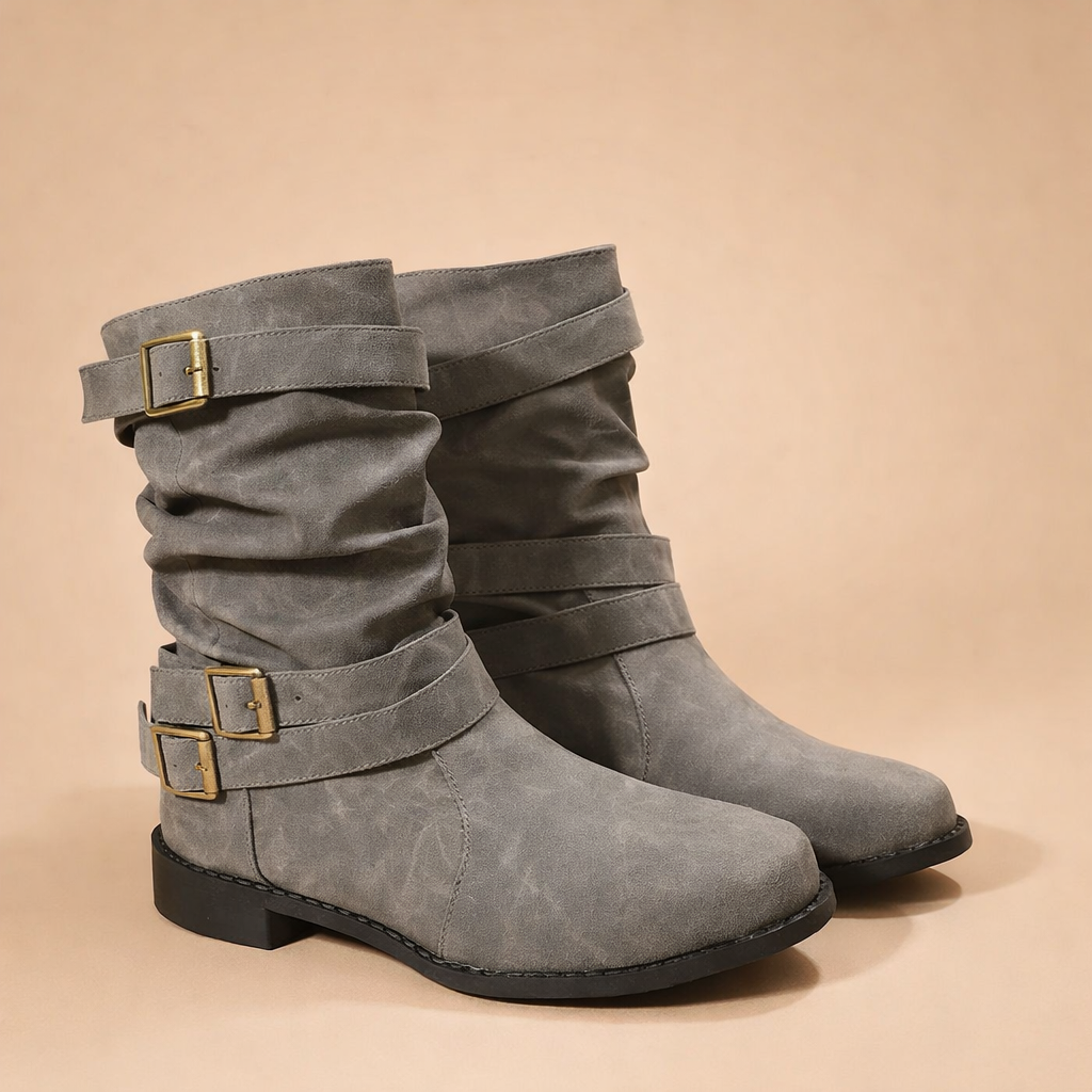 Brown mid-calf winter boots for women, featuring chic buckle straps. Fashionable and comfortable elegant footwear.