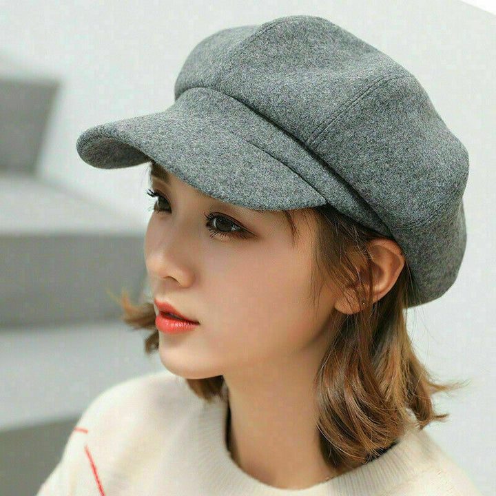 Chic women's vintage balloon hat, offering a retro look and warm cotton comfort for winter outfits.
