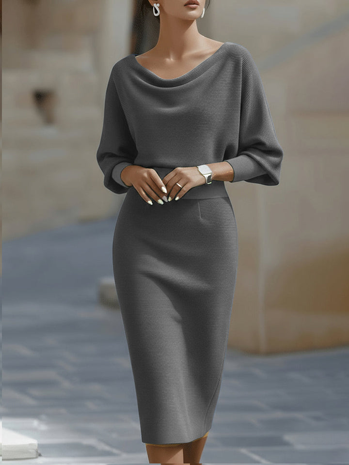 Full shot of women's elegant draped batwing midi dress, ideal for evening wear & formal events.
