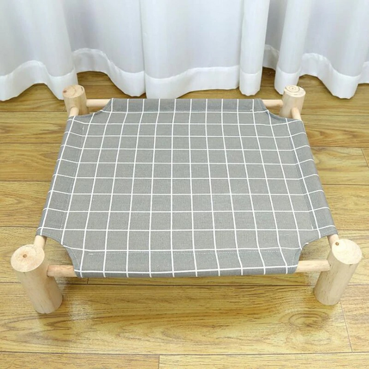 Stylish elevated cat furniture, a comfortable pet lounge for feline friends, featuring a removable washable cover.