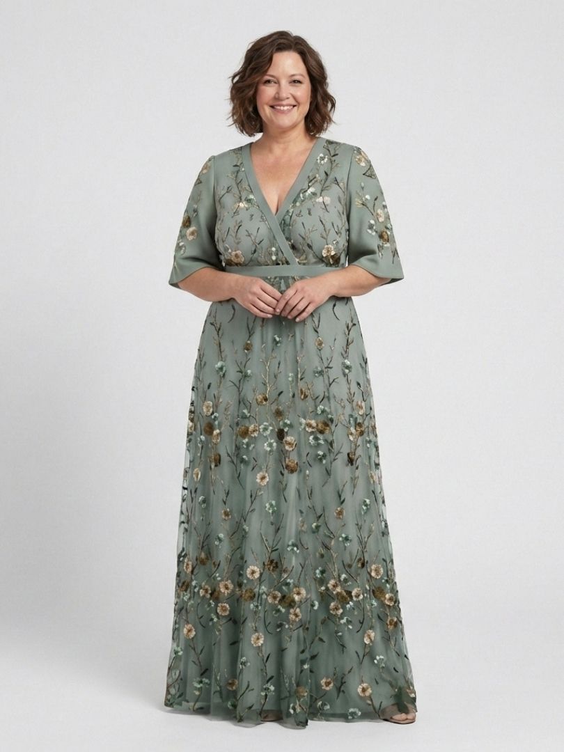 Women's green floral V-neck short sleeve maxi dress with elegant flowing design. Ideal for summer evenings.