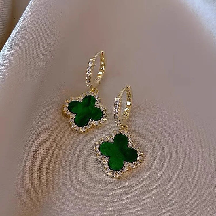 Elegant gold-plated clover leaf earrings for women, featuring a timeless design with sparkling crystals.