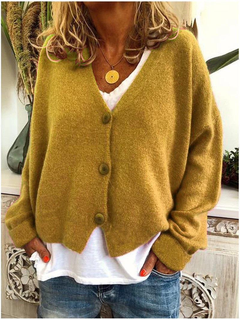 Close-up of a women's chic V-neck button-front cardigan, highlighting knit texture.