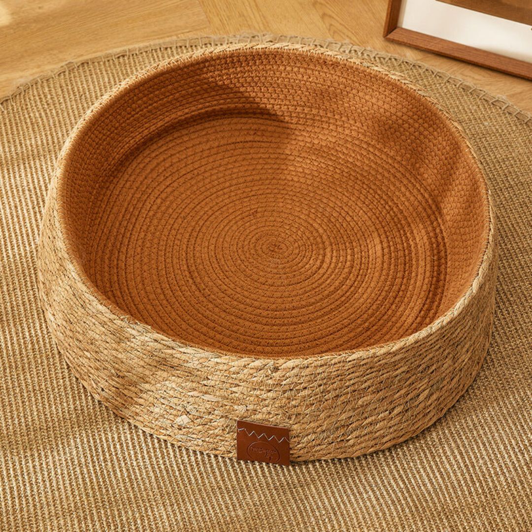 Rattan cat scratching bed, hand-woven from natural materials. Provides a durable surface for feline nail care.